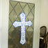 Blue and white cross door hanger on door